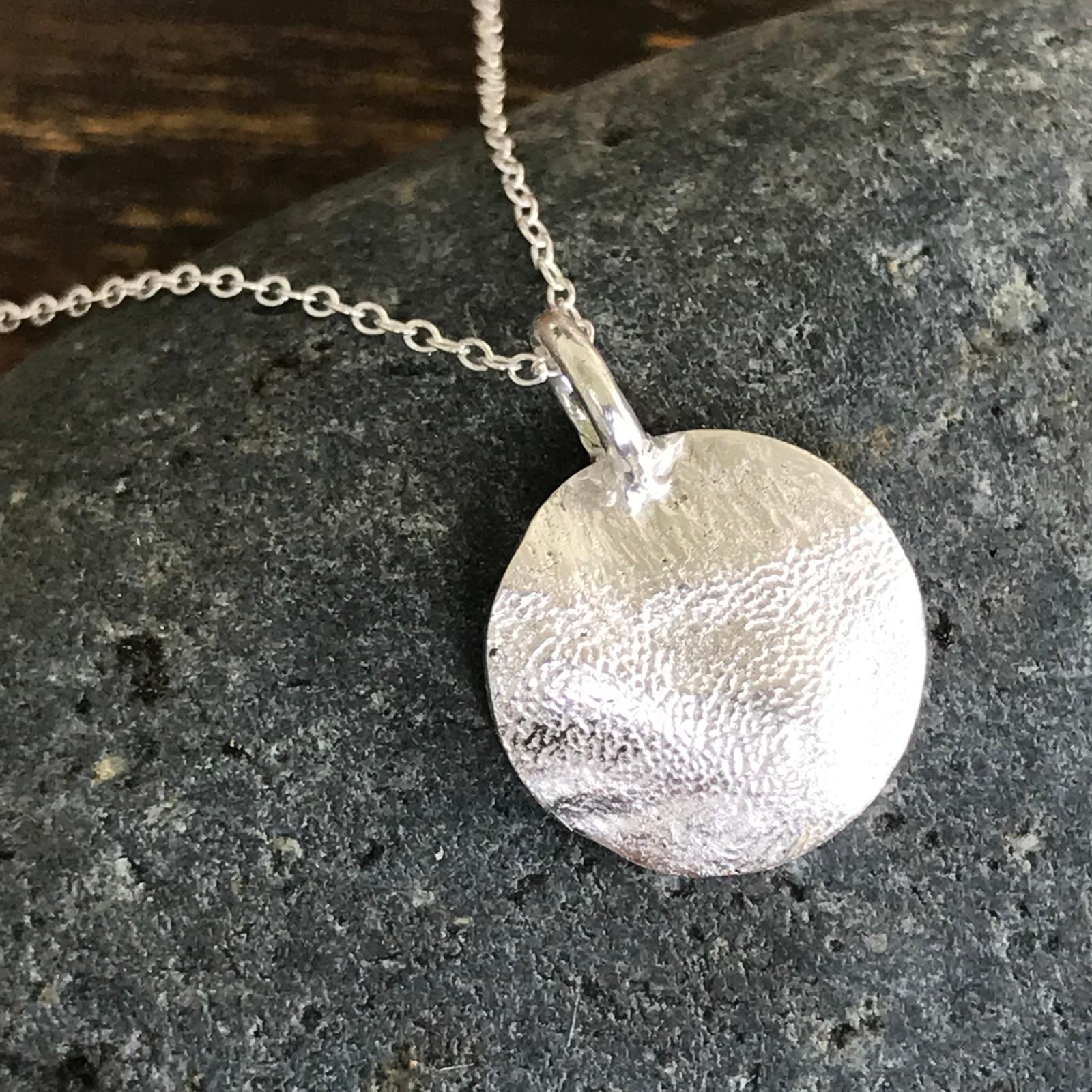 Silver paw print pendant in Singapore for everyday wear