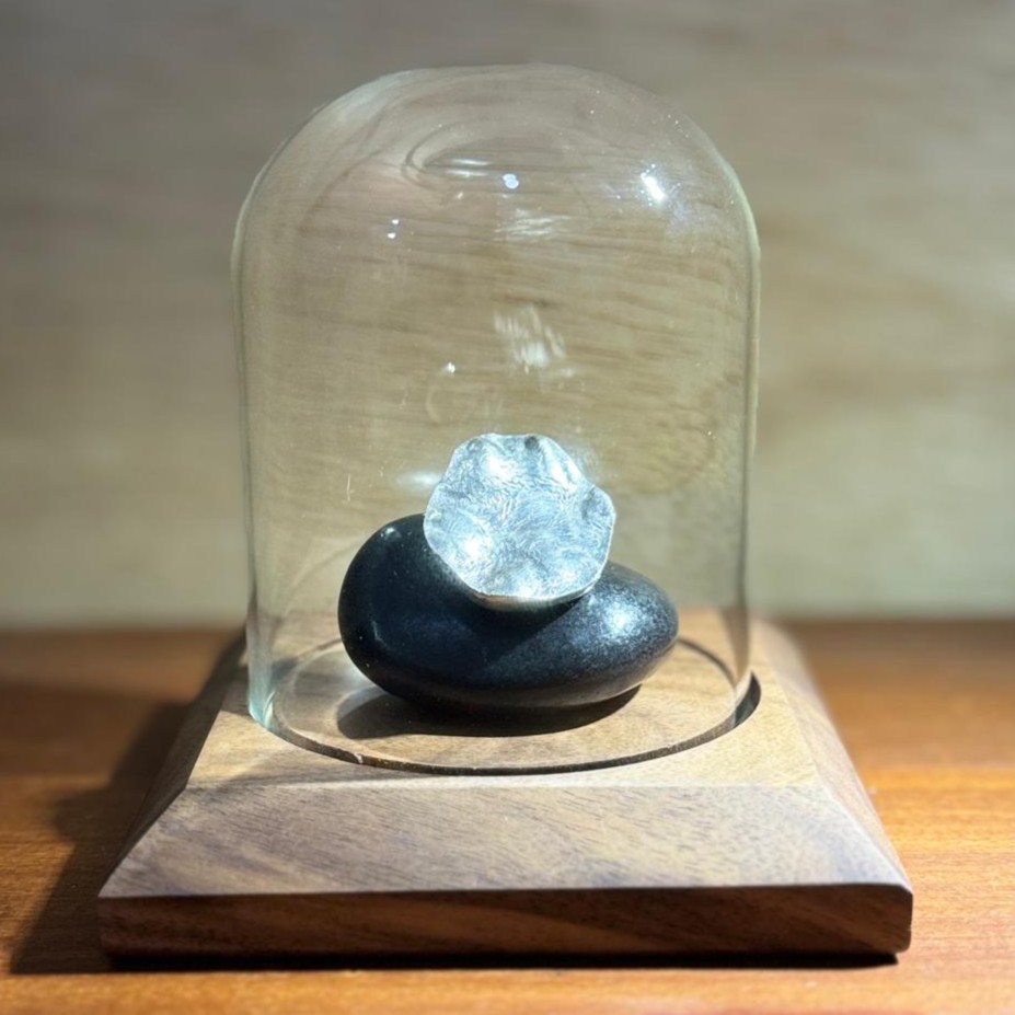 Desk display with paw-print keepsake under glass dome