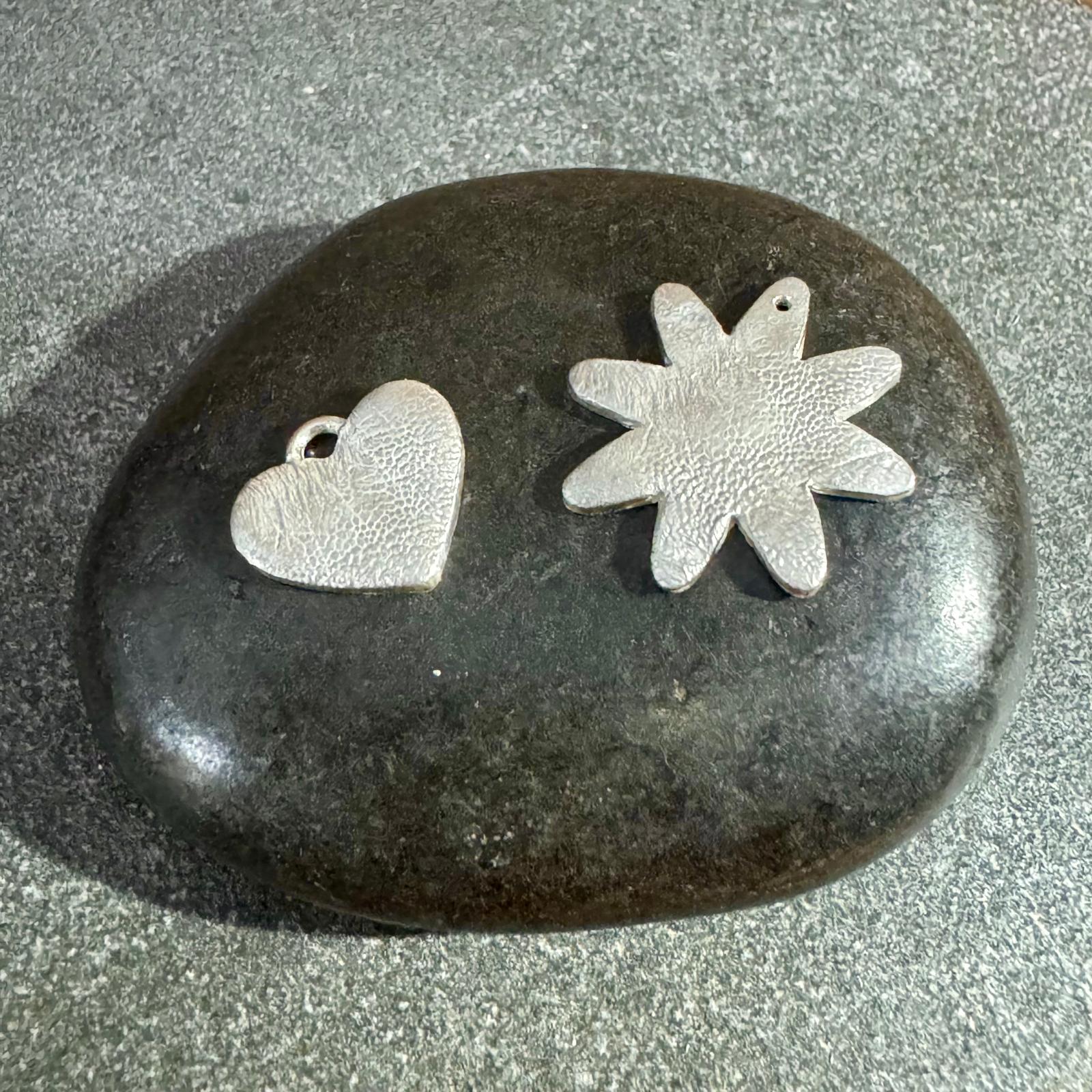 Two matching pendants, one adult-sized and one child-sized